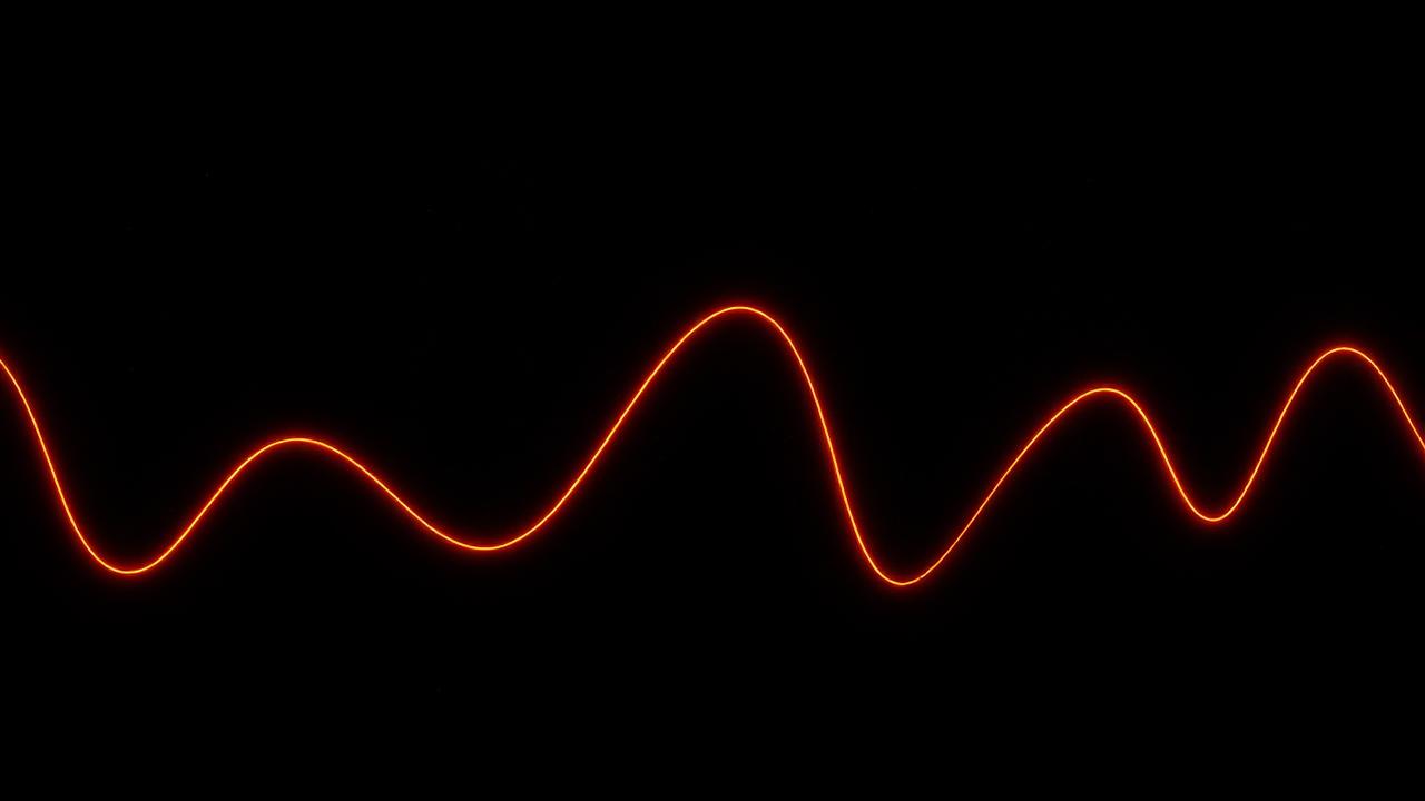 Onda de audio y datos en naranja sobre fondo oscuro